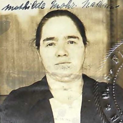 Aged photo of women with thicker eyebrows looking forward